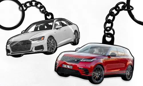 Car-shaped keychains featuring a white sedan and a red SUV as customizable automotive accessories