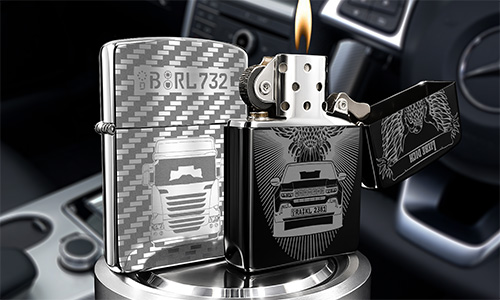 Engraved stainless steel lighters display truck designs while resting inside a car interior