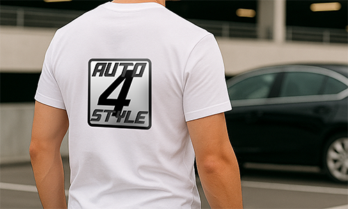Person wearing personalized white “AUTO 4 STYLE” t-shirt with bold logo — standing in parking garage near black car.