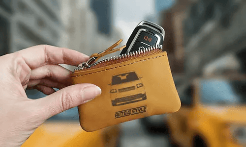 Brown zippered pouch with printed truck front and plate 