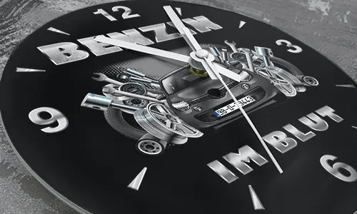Wall clock with black sports car, pistons and wrenches, BENZIN IM BLUT text on black background