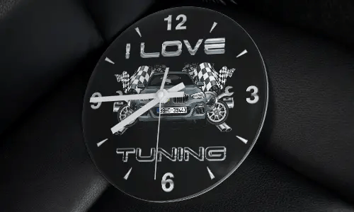 Wall clock with modified car, racing flags, wheels, and I LOVE TUNING text on black background