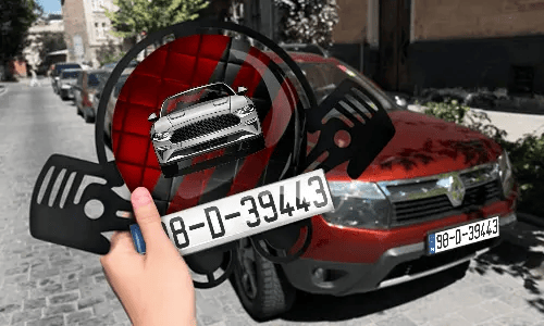 Autoschlüsselanhänger in der Hand mit dem Kennzeichen auto schlüsselanhänger gravur