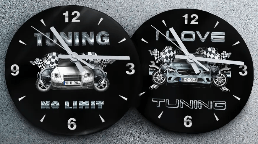 Two racing-themed wall clocks: left with black car and TUNING NO LIMIT text, right with blue car and MOVE TUNING text